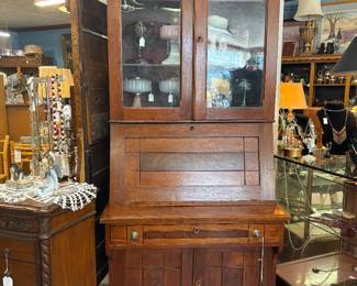 Magnificent early 1900s Victorian drop front with shelves and glass front walnut desk with cubbies and blotter and drawers