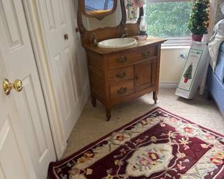 antique oak dresser turned bathroom sink( all the parts are there to hook up to your water supply) 