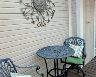 High outdoor table and chairs with cushions