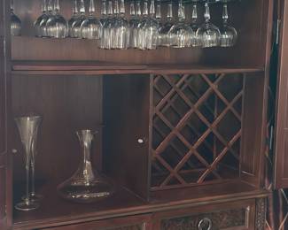 Dark brown Renaissance style bar cabinet