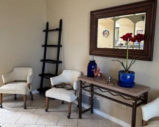 Set of four beautiful castor Chairs very comfortable also a pair of wall bookshelves, a beautiful stone and iron wall council Woodmere