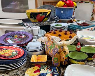 Lots of fun Mexican inspired pottery, wall plates, fruit bowl, lots of fun on this counter