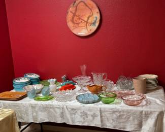 We have quite a few large pottery wall hanging pieces plus this table is full of fun items for your table