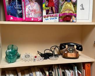 Barbies, Barbies, a beautiful Antique Copper, telephone, and some books to read while you’re listening to someone speak on the telephone 