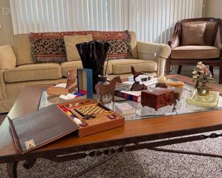 Coffee table iron base, wood top, lots of goodies on top matching pair of couches