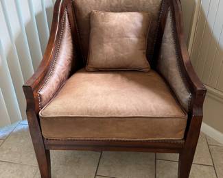 Gorgeous, very well-made wood with embossed, leather chair, matching pillow