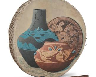 1270 Raejeanne (20th Century, Navajo/Diné) Painted drum Painted hide stretched on wood with wood and fabric beater Signed at left side: RAEJEANNE 2 pieces Drum without handle: 3.25" H x 20" W x 20.75" D; Beater: 16.75" L Estimate: $300 - $500