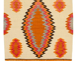 1089 A Navajo saddle blanket Late 19th/early 20th century, Diné Woven in cream, orange, red, brown, and grey wool with a radiating central diamond and alpaca/goat fringe 20" H x 20" W; Fringe: 3" Estimate: $200 - $400