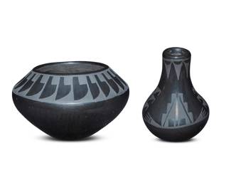 1292 Two San Ildefonso Pueblo blackware pottery vessels Two works:  Anita Martinez (1927-1994, San Ildefonso Pueblo) A small vase, mid-20th century Incised to underside: Anita Martinez / [cloud cipher] With slip-painted band of stepped motifs to shoulder 3.75" H x 2.75" Dia.  Juan Tafoya (1949-2006, San Ildefonso Pueblo) A small jar, 1976 Incised to underside: JUAN TAFOYA / SAN ILDEFONSO / 76 With slip-painted band of feather motifs to shoulder 3" H x 5" Dia.  2 pieces Estimate: $200 - $300