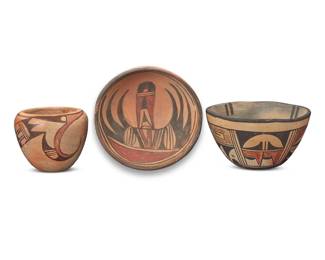 1311 Three Hopi Pueblo polychrome yellowware pottery vessels Mid-20th century Each unmarked Comprising a bowl, a low bowl, and a jar, each decorated with black and red avian motifs on a yellow slip ground 3 pieces Largest bowl: 3.625" H x 3.625" Dia.; Jar: 4" H x 4.625" Dia. Estimate: $200 - $400