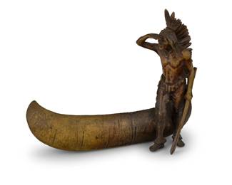 1329 Attributed to Carl Kauba (1865-1922) Indian Scout with Canoe Patinated bronze Unsigned; impressed with Bergmann 'bottle B' foundry mark and: 3605 / GESCHUTZT 7.125" H x 8.5" W x 3.875" D Estimate: $500 - $700