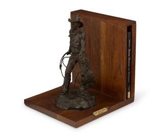 1145 Grant Speed (1930-2011) "The Bronc Rider," 1979 Patinated bronze on wood bookstand with signed hardcover book Bronze edition: 25/100 Signed, dated, inscribed and numbered in the casting: UG Speed / © / CA With hardcover book: Hedgpeth, Don. "From Broncs to Bronzes: The Life and Work of Grant Speed." Flagstaff, AZ: Northland Press, 1979 Signed Limited Edition: 25/100 Signed to edition page: U. Grant Speed Bronze: 12" H x 7.5" W x 5.75" D; Overall: 12" H x 11.25" W x 10.25" D Estimate: $800 - $1,200