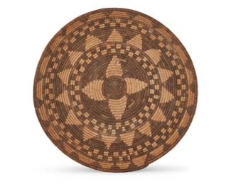 1056 A Yavapai basketry bowl Early 20th century; Southwest United States The coiled bowl with alternating bands of diamonds and checkers 2.75" H x 12.75" Dia. Estimate: $500 - $700