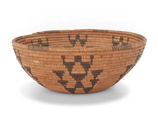 1015 A Panamint Shoshone basketry bowl Early 20th century; Central California The coiled bowl with partial rim ticking above six arrangements of stacked triangles 3" H x 7.75" Dia. Estimate: $600 - $800