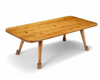 1154 A Barnard & Simonds wood coffee table Mid-20th century With applied metal factory label With antique cherry finish and three butterfly keys, raised on hoof feet 17.25" H x 54" W x 26" W Estimate: $300 - $500