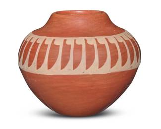 1291 Santana & Adam Martinez (1909-2000 & 1903-2000, San Ildefonso Pueblo) A small redware jar, mid/late 20th century Incised signatures to underside: Santana / Adam With slip-painted banded feather motifs to shoulder 2.75" H x 3.375" Dia. Estimate: $200 - $400