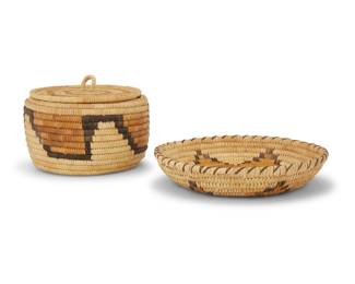 1351 A group of Papago baskets Early/mid-20th century, Tohono O'odham; Southwest United States Five coiled baskets comprising a small basketry tray woven by Amelia Ramon, with radiating hooked motifs in a 'turtle back' design (1.5" H x 9" Dia.), a large basketry tray with stylized animal motifs (1.75" H x 12.25" Dia.), a high-sided tray with floating stepped motifs (2.25" H x 11.5" Dia.), a polychrome oval tray with checkerboard stepped motifs (1.75" H x 11.5" W x 9" D), and a polychrome lidded basketry jar with floating geometric motifs (4" H x 6" Dia.) 5 pieces Estimate: $100 - $200