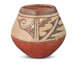 1295 Van & Lela Gutierrez (1870-1956 & 1895-1966, Santa Clara Pueblo) A small polychrome redware pottery jar, mid-20th century Signed to underside: Van + Lela The six-color jar with banded geometric motifs on a cream slip ground above a terracotta wash 5.25" H x 5.75" Dia. Estimate: $300 - $500