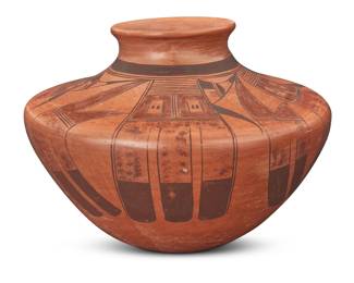 1296 Jean Sahme Nampeyo (1948-2024, Hopi-Tewa) A polychrome pottery jar, late 20th/early 21st century Signed to underside: JEAN SAHME NAMPEYO With red and brown band of feather motifs issuing from shoulder on a terracotta ground 5.625" H x 7.875" Dia. Estimate: $300 - $500