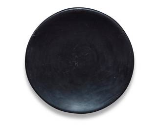 1290 Maria [Pond Lily] Povika Montoya Martinez (1887-1980, San Ildefonso Pueblo) A blackware pottery dish, mid-20th century Incised signature to underside: Maria Povika 1" H x 6.125" Dia. Estimate: $400 - $600