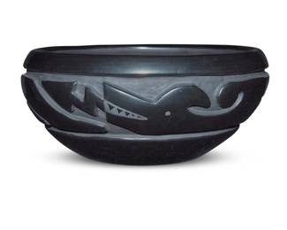 1072 Betty Tafoya (1933-1988, Santa Clara Pueblo) A blackware pottery bowl, mid/late 20th century Incised to underside: Betty Tafoya / Santa Clara Pueblo / Espanola, New Mexico With deeply carved banded Avanyu motif 4.375" H x 9.75" Dia. Estimate: $400 - $600