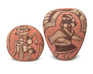 1298 Two Hopi Pueblo carved polychrome pottery jars Two works: Marty Naha & Elvira Nampeyo (b. 1970 & b. 1968, Hopi-Tewa) A small pictorial seed jar, 1993 Signed and dated to underside: Marty & Elvira / '93 / Nampeyo With slip-painted incised decorations depicting a dancing katsina figure to one side 3.875" H x 4.25" W x 2.375" D Tom Polacca (1935-2003, Hopi-Tewa) A carved pottery jar, late 20th century Signed: Tom Polacca With slip-painted incised decorations depicting a katsina figure and bands of feathers 5.625" H x 4.75" Dia. 2 pieces Estimate: $500 - $700