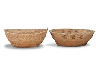 1031 Two large Washoe utilitarian basketry bowls Early 20th century; Great Basin The coiled bowls, comprising one with the rim wrapped in fabric above simple floating geometric designs, and one undecorated with opposed handles 2 pieces With designs: 7.25" H x 21.25" Dia.; The other: 9" H x 21" Dia. Estimate: $400 - $600