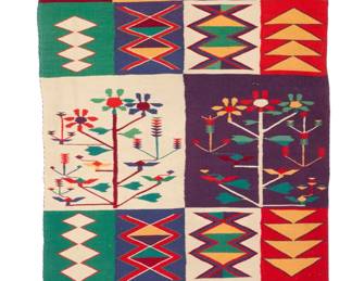 1077 A Navajo Germantown pictorial Sunday saddle blanket Late 19th century, Diné Woven in multicolor wool, depicting two central plant-form motifs opposed by eight squares with various geometric patterns 47" H x 29.25" W Estimate: $1,000 - $1,500