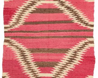 1078 A Navajo regional blanket Late 19th/early 20th century, Diné Woven in red, dark brown, cream, and natural grey wool, with a serrated near-diamond at center and banding 75" H x 49" W Estimate: $700 - $900