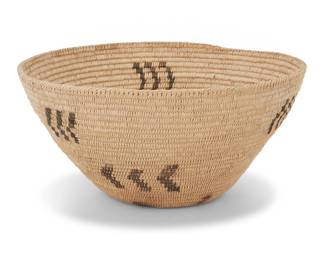 1028 A Washoe polychrome basketry bowl Mid-20th century; Great Basin The coiled bowl with diagonal rim stitching above six floating triple chevrons 5.875" H x 12.25" Dia. Estimate: $400 - $600
