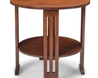 1334 A Stickley Mission style round side table, no. 89-663 2012 With factory burn mark and applied metal Mission Reissue label; stamped with date and model number: 89 663 / 32 With four spindle supports joined by a circular undertier 28.75" H x 29" Dia. Estimate: $400 - $600