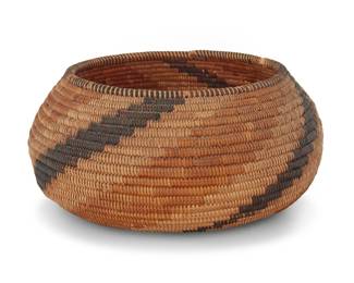 1036 A California Mission polychrome basketry bowl Early 20th century; Southern California The coiled bowl with rim ticking above radiating arms issued from center to rim 3.125" H x 6.625" Dia. Estimate: $500 - $700