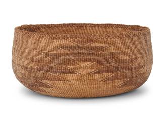 1242 A Northwest California basketry bowl Early/mid-20th century, likely Hupa/Karok/Yurok; Northern California The twined bowl with a braided rim above a serrated zig-zag band 3.375" H x 8" Dia. Estimate: $300 - $500