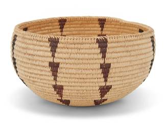 1042 A Paiute polychrome basketry bowl Early 20th century; Great Basin The coiled bowl with diagonal-stitch rim above columns of inverted stacked triangles 3.75" H x 7.5" Dia. Estimate: $500 - $700