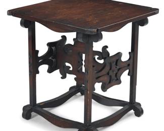 1202 Charles Rohlfs (1853-1936) An Arts & Crafts quarter sawn oak side table, 1900 Impressed with maker's 'R' cipher and date With stylized tabletop corners, raised on supports joined by a fretwork H-stretcher and shaped box base 21.5" H x 21" W x 21" D Estimate: $4,000 - $6,000