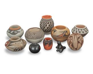 1313 A group of ten diminutive Southwest Pueblo pottery items Mid-20th century-early 21st century Each but two variously signed Comprising a Helen [Feather Woman] Naha (1922-1993, Hopi-Tewa) olla, an Emma Naha (b. 20th century, Hopi-Tewa) polychrome yellowware seed jar, a Stella Teller (b. 1929, Isleta Pueblo) polychrome olla, a Joanne Tsanatewa (b. 20th century, Hopi-Tewa) seed jar, a Mary Tenorio (b. 1946, Santo Domingo Pueblo) redware jar, a 'Myra Garcia' blackware bowl, two 'L. Concho' jars, a polychrome yellowware olla, and a blackware dinosaur figure 10 pieces Largest: 2.75" H x 2.25" W; Smallest: 1" H x 1.5" Dia. Estimate: $200 - $400