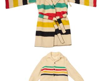 1423 Two Hudson Bay Company point blanket wool coats Mid/late 20th century Each with label for Hudson's Bay Company; large coat with additional Made in England label Comprising a long oversized point blanket striped wrap coat with hood, wide sleeves with fringing, and self-tie belt, likely repurposed from an older blanket, together with a long sleeved striped wool jacket with button front and flap patch pockets and partial lining to shoulder 2 pieces Larger: 49" H at CB; 27" W across back at underarms; sleeves from neck: 31" Smaller: 30" H at CB; 22" W across back at underarms; sleeves from neck: 25.5" Estimate: $300 - $500
