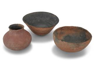 1323 Three Ancestral Puebloan pottery vessels Circa 12th-15th century Comprising two bowls and a micaceous olla jar, two with corrugation to exterior 3 pieces Larger bowl: 5" H x 10" Dia.; Olla: 5.25" H x 6.5" Dia. Estimate: $400 - $600