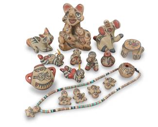 1320 Margaret & Luther Gutierrez (1936-2018 & 1911-1987, Santa Clara Pueblo) A large group of diminutive polychrome pottery items, mid/late 20th century Each variously signed Comprising animal storytellers, koshare clowns with grass accents, a mudhead, three jars, a frog, and five small figures, one of which serves as a pendant for a shell and turquoise necklace, together with a cat figure by Stephanie Naranjo (b. 1960, Santa Clara Pueblo) 16 pieces Largest: 3.375" H x 2.625" W x 2.125" D; Necklace length: 9.125" Estimate: $200 - $300