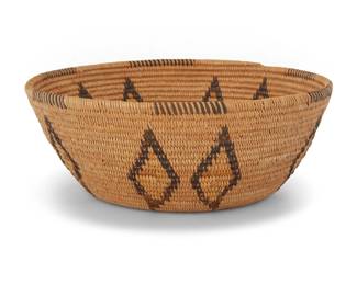 1016 A Panamint Shoshone polychrome basketry bowl Early 20th century; Great Basin The coiled bowl with partial rim ticking above five pairs of floating diamonds and a star at center of base 4" H x 8" Dia. Estimate: $500 - $700