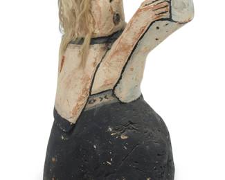 1277 James Kootshongsie (1916-1996, Hopi-Tewa) A polychrome carved cottonwood figure, mid-20th century Unmarked Depicting a mother and child with applied goat hair 12.625" H x 8.375" W x 7.875" D Estimate: $1,200 - $1,800