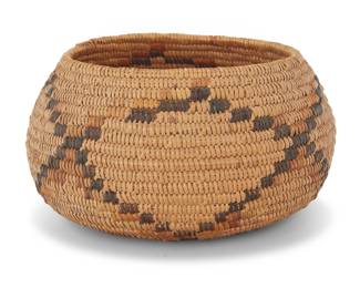 1039 A California Mission polychrome basketry bowl Early 20th century; Southern California The coiled bowl with a lattice motif above central star to base 4" H x 7.625" Dia. Estimate: $300 - $400