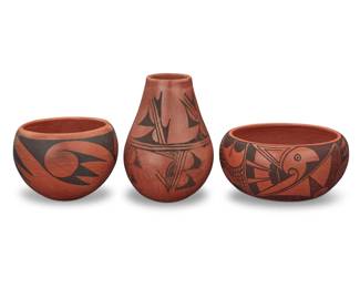 1308 Three Hopi Pueblo redware pottery vessels Three works: Hattie Navajo (c. 1866-1960, Hopi-Tewa) A black on red bowl, mid/20th century Signed to underside: Hattie Navajo With bands of raincloud motifs 3.5" H x 7.25" Dia. Frieda Poleahla (1918-1994, Hopi-Tewa) A black on red bowl, mid/late 20th century Signed to underside: Frieda Poleahla With banded bird wing motifs to shoulder 4.125" H x 5.75" Dia. A black on red vase, mid/late 20th century Signed to underside possibly reading: annabelle adams With geometric motifs to shoulder and body 6.75" H x 4.875" Dia. 3 pieces Estimate: $200 - $400