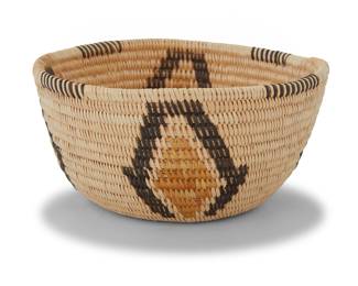 1020 A Panamint Shoshone polychrome basketry bowl Early 20th century; Great Basin The petite coiled bowl with partial rim ticking above four near-diamond designs 2.375" H x 4.75" Dia. Estimate: $300 - $500