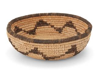 1059 A small Chemehuevi basketry bowl Early 20th century; Southwest United States The coiled bowl with a sawtooth band along the body 2.25" H x 6.5" Dia. Estimate: $100 - $200