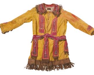 1371 An Eastern Woodlands style beaded velvet jacket Early 20th century With interior label: The Ward Stilson Co. / MFRS. of Society Goods / Anderson, Ind. The yellow cotton velvet snap-front coat with red velvet beaded elements including collar, front strips, cuffs, and tabbed fringed belt, each with polychrome floral and herringbone beadwork and large faceted glass paillettes, the collar, sleeves, belt, and hem with brown suede fringing, and the coat fully lined in linen/cotton 40" H x 23" W (across front underarms); sleeves: 23.5" L Estimate: $200 - $400