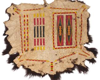 1356 Martin Red Bear (b. 1947, Oglala/Sicangu Lakota) A painted buffalo robe, 1995 Signed and dated: MRed Bear - 95 - Lakota Pigment on hide, with red, yellow, and black box-and-border and outlined anatomy designs 78" H x 70" W Estimate: $1,000 - $1,500