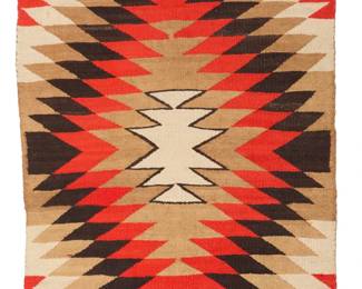 1086 A Navajo regional rug Early/mid- 20th century, Diné Woven in red, dark brown, cream, and ochre wool, with a central serrated diamond 45.25" H x 33" W Estimate: $300 - $500