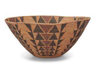 1001 A large Yokuts polychrome basketry bowl Early 20th century; Central California The coiled bowl with six graduated stacked diamond columns on a bundle foundation 10.5" H x 24" Dia. Estimate: $2,000 - $3,000