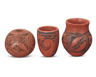 1306 Three Hopi Pueblo redware pottery jars Three works: Anita Polacca (b. 1924, Hopi-Tewa) A black on red jar and vase, mid/late 20th century Each signed to underside: anita Polacca Each painted with geometric motifs 2 pieces Jar: 5" H x 4.375" Dia.; Jar: 4" H x 3" Dia. Marilyn Shula Sakeva (1955-2019, Hopi-Tewa) A round seed pot, late 20th century Signed to underside: Marilyn Shula Painted with stepped and raincloud motifs 3.875" H x 4.25" Dia. 3 pieces total Estimate: $200 - $400